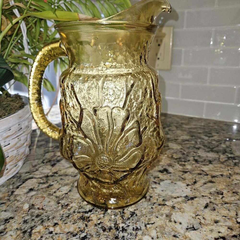 Golden Amber Glass Pitcher with Floral Relief Design